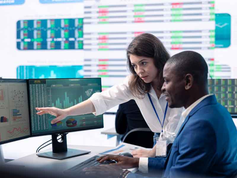 two people looking at a screen
