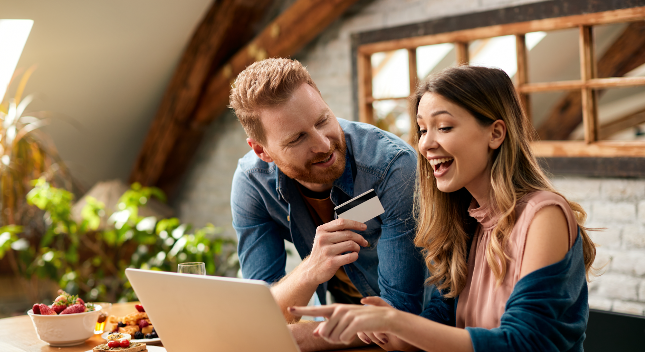 A couple is shopping online at home