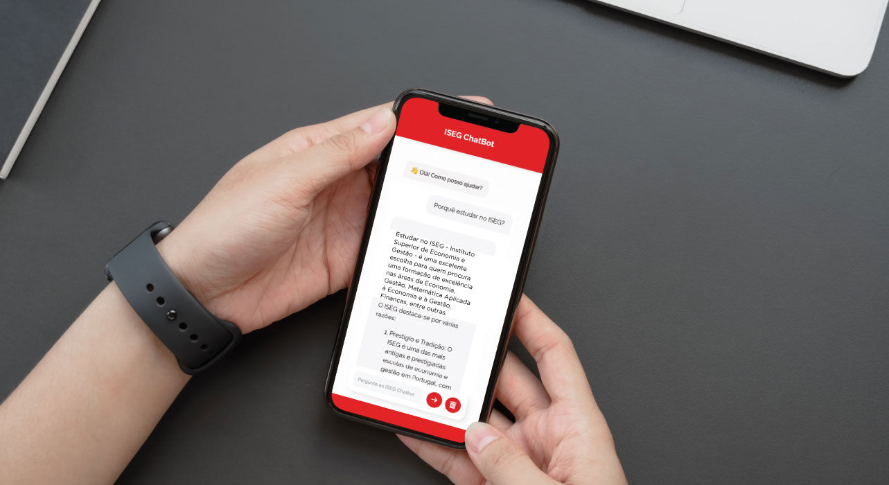 Person holding a smartphone with a red and white app interface displayed